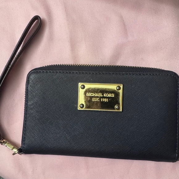 michael Kors Handbags - Reduced 💕Michael Kors Navy Clutch with Gold Accents